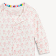 Load image into Gallery viewer, A close-up of a baby long-sleeve sleep sack or pajama top in white with a light pink fairy print, featuring a colorful striped inner neck trim.
