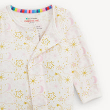 Load image into Gallery viewer, A baby long-sleeve sleep sack by Eco-Friendly Magnetic Me, featuring a white base with a celestial print of gold stars, pink crescent moons, and gold/yellow suns. The inside collar is decorated with a colorful striped band.
