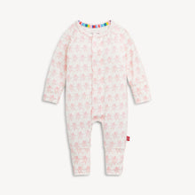 Load image into Gallery viewer, A baby long-sleeve footless one-piece sleeper in white with a light pink teddy bear pattern, featuring a colorful striped inner collar and a small red tag on the leg.
