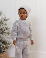 Load image into Gallery viewer, Quincy Mae fog-gray chunky knit pants with a drawstring waist and ribbed ankle cuffs, shown on a boy wearing a matching sweater and hat, standing.
