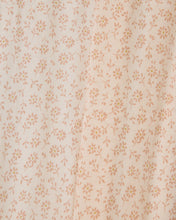 Load image into Gallery viewer, A close-up of a light cream fabric with a repeating small floral print in a muted peach or dusty rose color.
