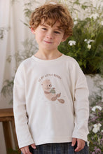 Load image into Gallery viewer, A young boy with curly light brown hair wearing a cream-colored long-sleeve shirt with a teddy bear graphic and the text 'BE MY LITTLE BUDDY'.

