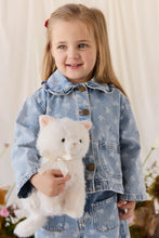 Load image into Gallery viewer, Child in floral denim holding Moon the Kitty plush, showing its white fur, cream bow, and long fluffy tail.
