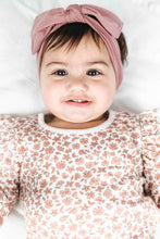 Load image into Gallery viewer, Baby wearing a floral outfit and pink headband on a white background
