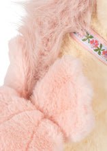Load image into Gallery viewer, Close-up of a plush toy or soft accessory with fluffy pale pink faux fur, a cream-colored body, and a decorative embroidered band with pink flowers and green leaves.
