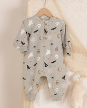 Load image into Gallery viewer, A baby long-sleeve footless one-piece romper in a light sage green, decorated with a cute Halloween pattern of white ghosts, black bats, orange lanterns, and brown moons. The romper is displayed on a wooden hanger against a soft beige fabric backdrop.
