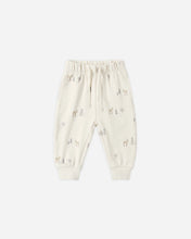 Load image into Gallery viewer, Off-white jogger pants for toddlers, featuring a small woodland print of deer and pine trees, with an elastic waistband and drawstring.
