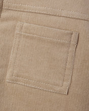 Load image into Gallery viewer, Close-up of the latte tan jacket’s square chest pocket, showing fine corduroy texture and matching stitching.
