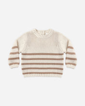 Load image into Gallery viewer, A cream-colored knit sweater with horizontal brown stripes, laid flat against a light gray background.
