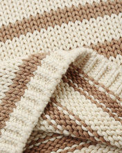 Load image into Gallery viewer, Close-up of a knitted fabric with horizontal stripes in cream, beige, and light brown, showing the texture and ribbed edge.
