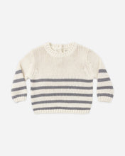 Load image into Gallery viewer, A cream-colored knit sweater with horizontal gray stripes across the chest and sleeves, laid flat against a light gray background.

