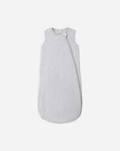 Load image into Gallery viewer, A light gray sleeveless baby sleep sack with a diagonal zipper, shown flat against a light gray background.
