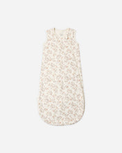 Load image into Gallery viewer, A sleeveless baby sleep sack with a light beige and white floral pattern, shown flat against a light gray background.
