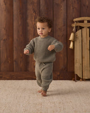 Load image into Gallery viewer, Toddler walking barefoot in spruce green chunky knit pants with a drawstring waist and matching sweater.
