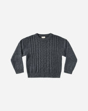 Load image into Gallery viewer, A dark gray cable-knit crewneck sweater with long sleeves, laid flat against a light gray background.
