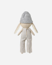 Load image into Gallery viewer, Back view of Ryder the Rabbit, showing the gray knit beanie and button closure on the striped overalls.
