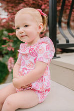 Load image into Gallery viewer, Baby wearing a pink romper sitting on a surface with a blurred background
