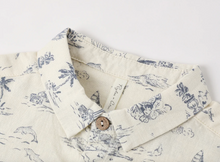 Load image into Gallery viewer, Close-up of a beige shirt with blue patterns on a white background
