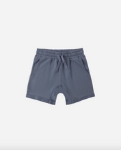 Load image into Gallery viewer, Blue shorts on a white background
