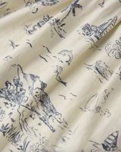 Load image into Gallery viewer, Fabric with blue animal prints on a beige background
