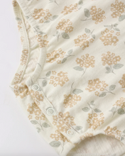 Load image into Gallery viewer, Baby romper with floral pattern on a light background
