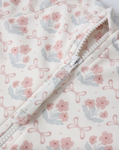 Load image into Gallery viewer, Floral patterned fabric with a zipper on a white background
