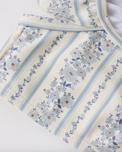 Load image into Gallery viewer, Floral patterned fabric with blue flowers and leaves on a white background
