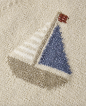 Load image into Gallery viewer, Textured fabric with a sailboat design featuring a blue sail and red flag.
