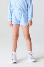 Load image into Gallery viewer, Person wearing a light blue outfit with colorful patterns on a plain background
