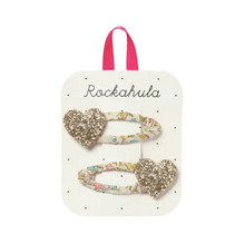 Load image into Gallery viewer, Heart-shaped hair clips with glitter on a Rockahula branded card.
