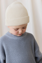 Load image into Gallery viewer, Child wearing a white knit hat and gray sweater against a plain background
