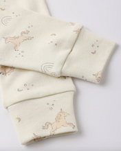 Load image into Gallery viewer, Folded fabric with unicorn and rainbow patterns on a light background
