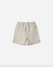 Load image into Gallery viewer, Beige shorts on a white background
