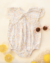 Load image into Gallery viewer, Floral baby romper with sunglasses and lemons on a yellow background
