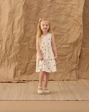 Load image into Gallery viewer, Young girl wearing polka dot dress on brown background
