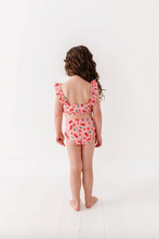 Load image into Gallery viewer, Child wearing a red and pink cherry swimsuit on a white background
