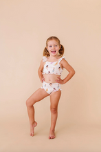 Load image into Gallery viewer, Young girl wearing a mermaid two-piece outfit on a beige background
