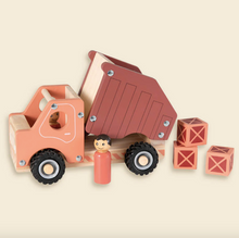 Load image into Gallery viewer, Wooden toy truck with a driver figure and blocks on a beige background
