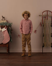 Load image into Gallery viewer, Collared Long Sleeve Shirt in Vintage Plaid on a boy by a toy sled
