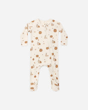 Load image into Gallery viewer, A baby long-sleeve footed sleeper in cream with a brown pumpkin and pear pattern, shown flat on a light gray background.
