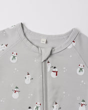 Load image into Gallery viewer, Close-up of the gray footie’s neckline and zipper guard, with snowmen in red and green scarves and white snowflakes.
