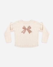 Load image into Gallery viewer, Ruffle Long Sleeve Tee in Bow, cream, front view laid flat
