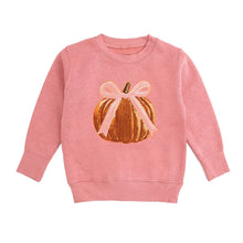 Load image into Gallery viewer, A pink crewneck sweatshirt featuring a graphic of a gold pumpkin with a light pink ribbon bow on the front, displayed against a solid white background.
