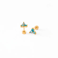 Load image into Gallery viewer, Blue ombré gem stud earrings with three clustered round stones in gold-tone settings, showing the posts and flat backs on a white background.
