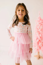 Load image into Gallery viewer, Closer front view of the Sugar Plum dress, showing pastel nutcracker and sweets motifs above the pink tulle skirt.
