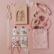 Load image into Gallery viewer, Collection of hair accessories including clips, headbands, and bows on a pink background
