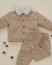 Load image into Gallery viewer, Closer flat lay of the latte tan jacket and matching pants, showing the cream fleece collar, front snaps, and patch pockets.

