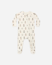 Load image into Gallery viewer, An off-white long-sleeve footed sleeper with a repeating pattern of small illustrated figures, photographed flat against a light gray background.
