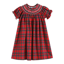 Load image into Gallery viewer, A red plaid baby dress with short puff sleeves, a smocked round neckline, and white embroidered geometric trim around the collar, shown on a plain white background.
