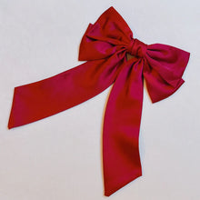Load image into Gallery viewer, Red satin bow on a light gray background
